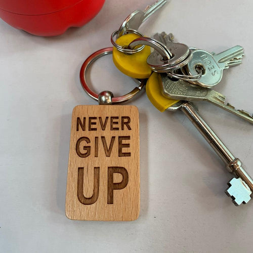 Personalised 'Never Give Up' Wooden Keyring (rectangular fob) made for you by Custom Gift Studio at Cheshire Oaks